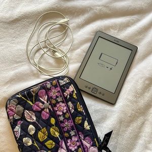 Kindle with charger cord and Very Bradley case